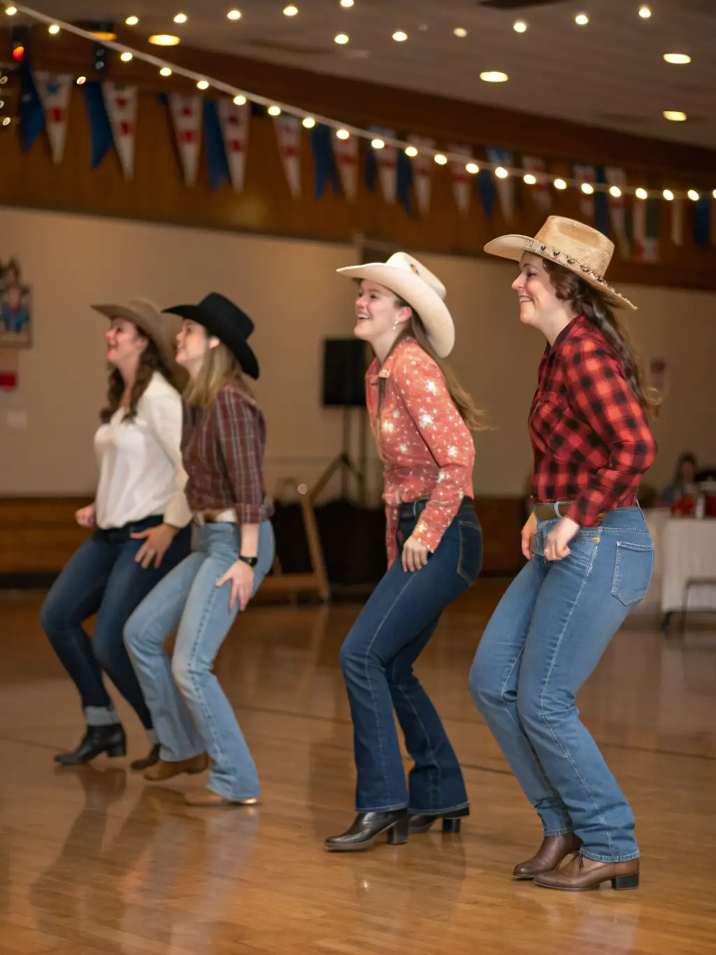 A dynamic shot of an advanced country dance performance, featuring intricate footwork and synchronized movements. The dancers are dressed in Western attire, adding to the visual appeal.
