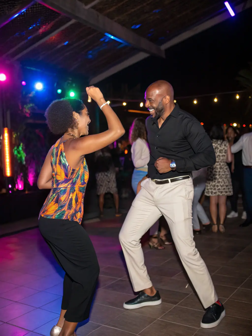An image of a couple gracefully performing a two-step during an intermediate country dance class. The dancers are smiling and engaged, showcasing the fun and social aspect of the class.